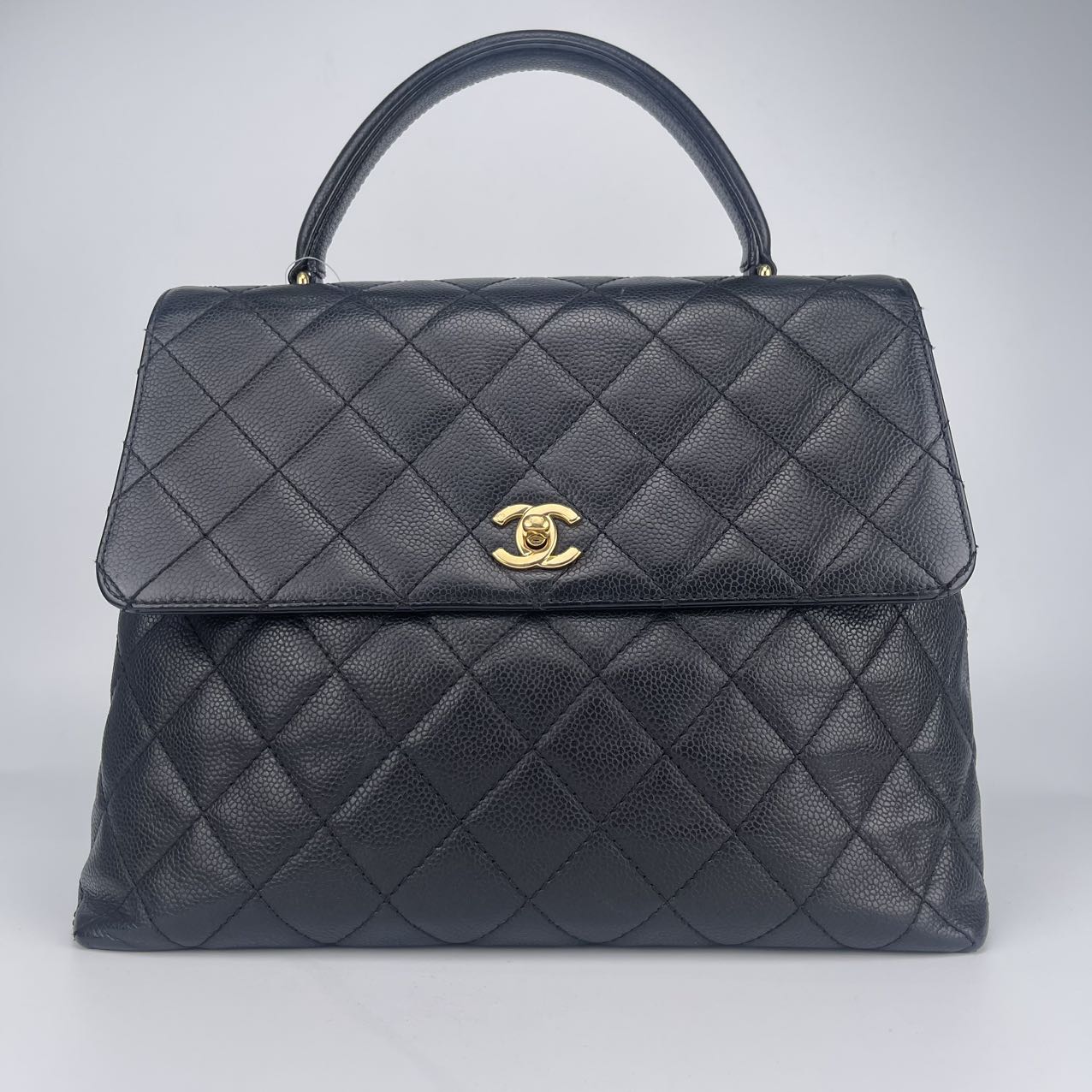 Chanel Black and Gold Kelly Handbag [Used]