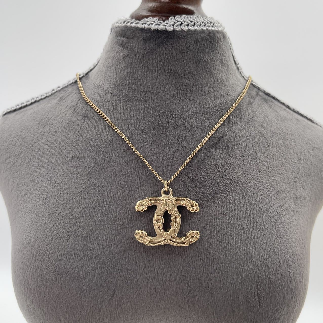 CHANEL Baroque Textured CC Logo Pendant Necklace in Gold Tone [Used]