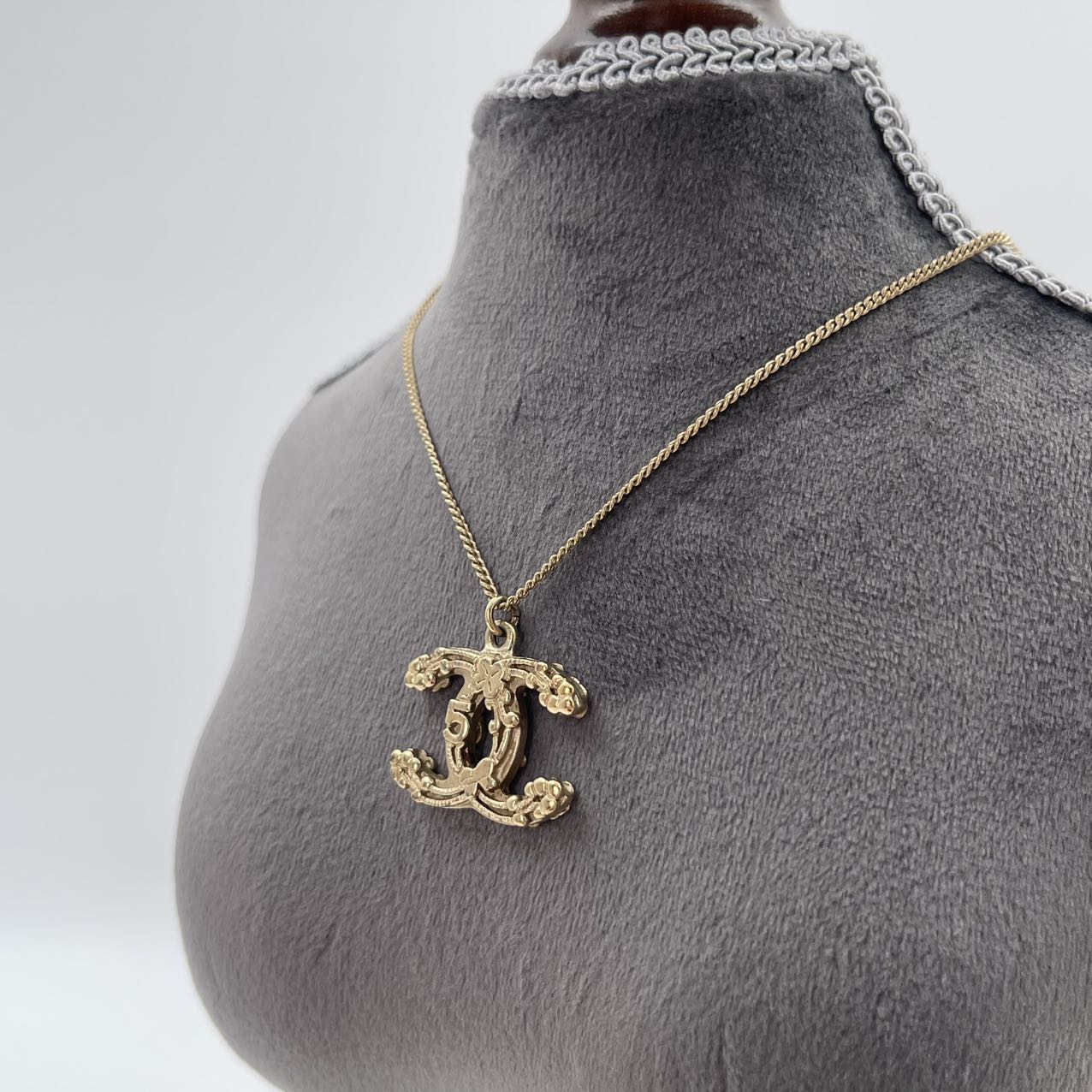 CHANEL Baroque Textured CC Logo Pendant Necklace in Gold Tone [Used]