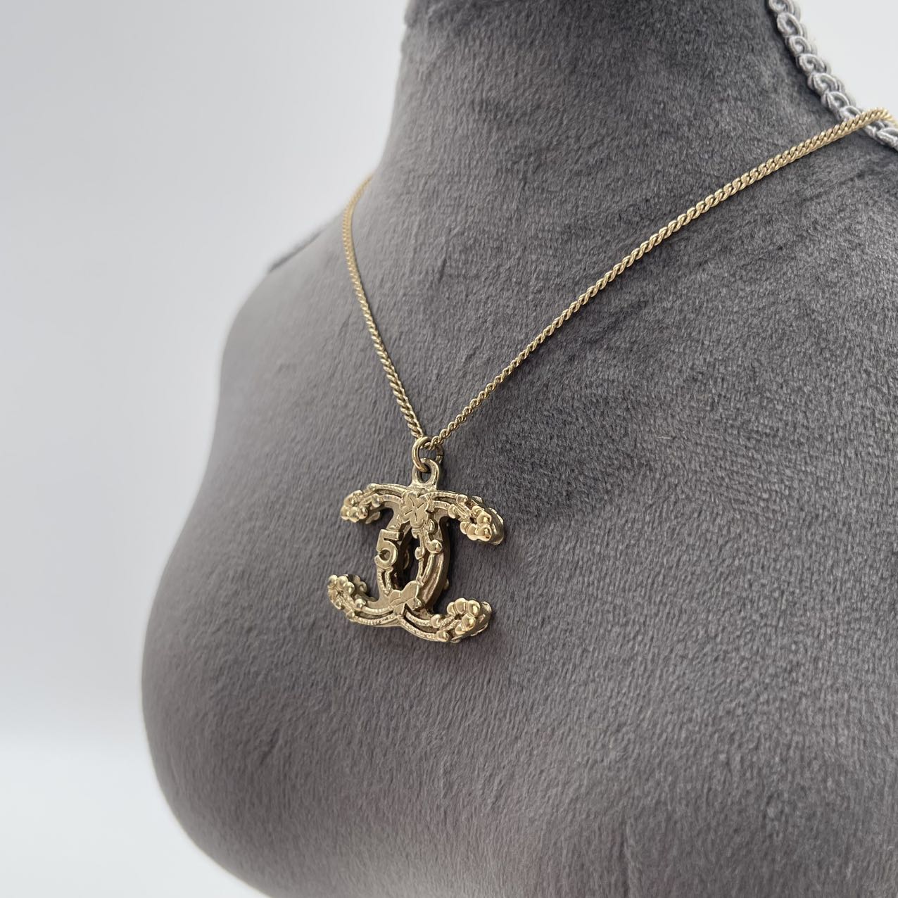 CHANEL Baroque Textured CC Logo Pendant Necklace in Gold Tone [Used]