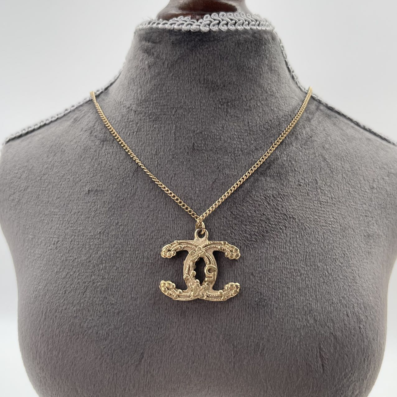 CHANEL Baroque Textured CC Logo Pendant Necklace in Gold Tone [Used]