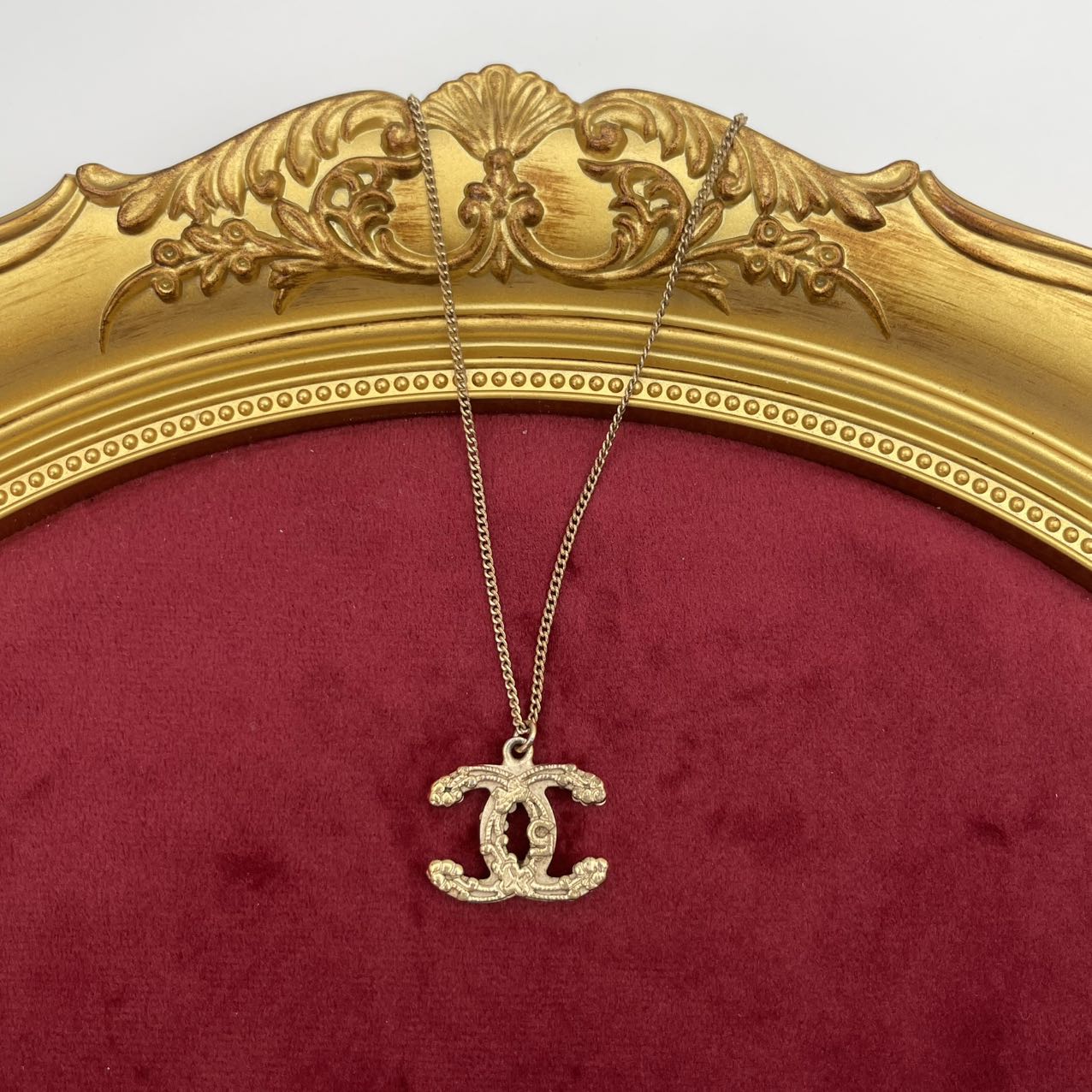 CHANEL Baroque Textured CC Logo Pendant Necklace in Gold Tone [Used]