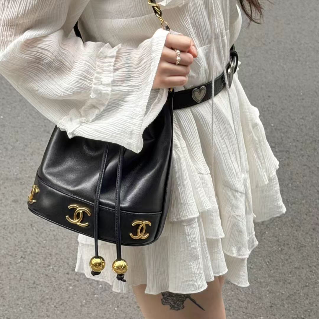 CHANEL Black Lambskin Six CC Logo Drawstring Bucket Bag [Used]